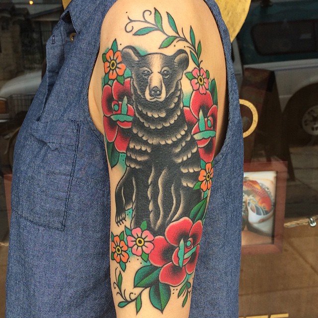 Mind Blowing Black Bear With Flower Vine Tattoo Design On Men Sleeve
