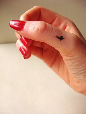 Small  Flying Bird Black Ink Tattoo On Women Thumb