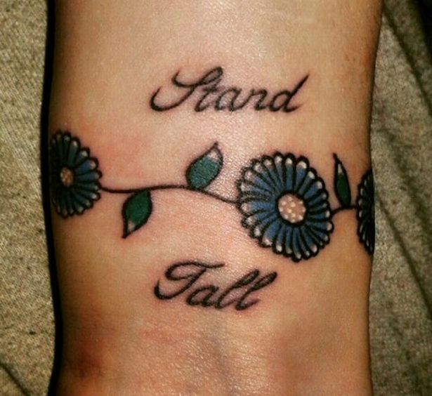 Stand Tall Flower Wine Depression Tattoo On Wrist