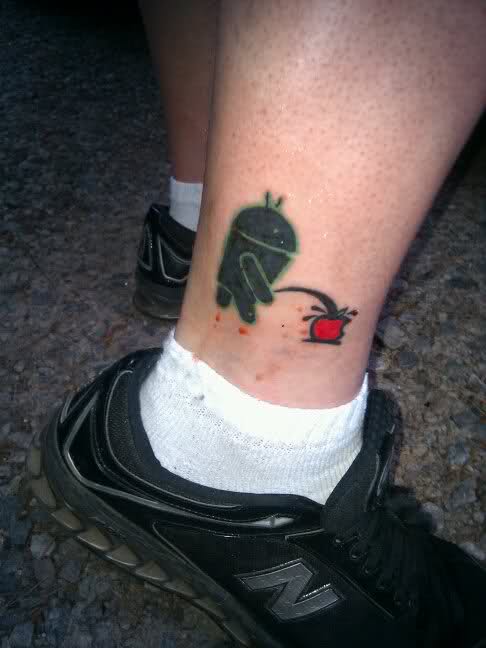 Wonderful Android Insulting Apple Tattoo Deisgn For Men Leg