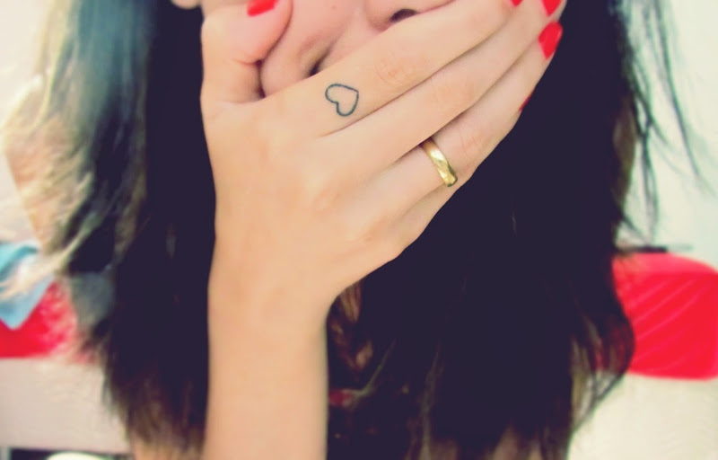 Cute Girl With Lovely Small Heart Tattoo On Index Finger