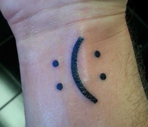 Cute Smiling and Crying Face Bipolar Tattoo On Arm