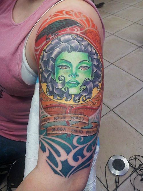 Latest Colorful Ink Animated Women Face Tattoo Design For Girl Upper Arm