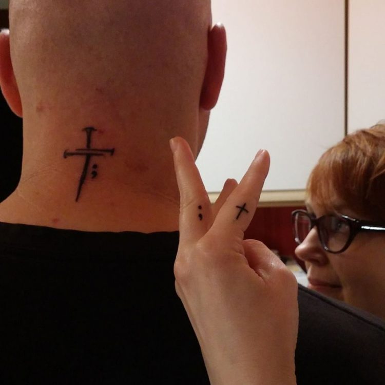 Man With Cross And Semicolon Depression Tattoo Design On Back Neck