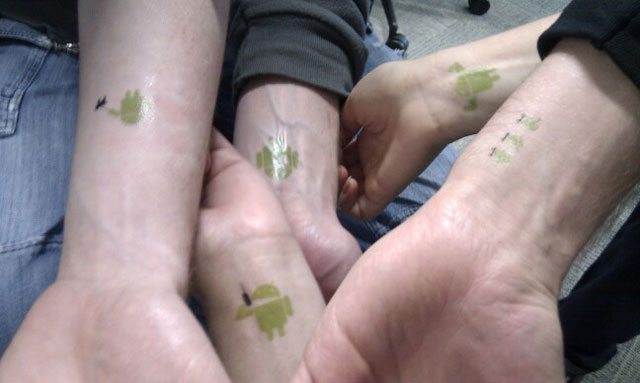 Nice Matching Android Green Ink Tattoo On Wrist For Friends